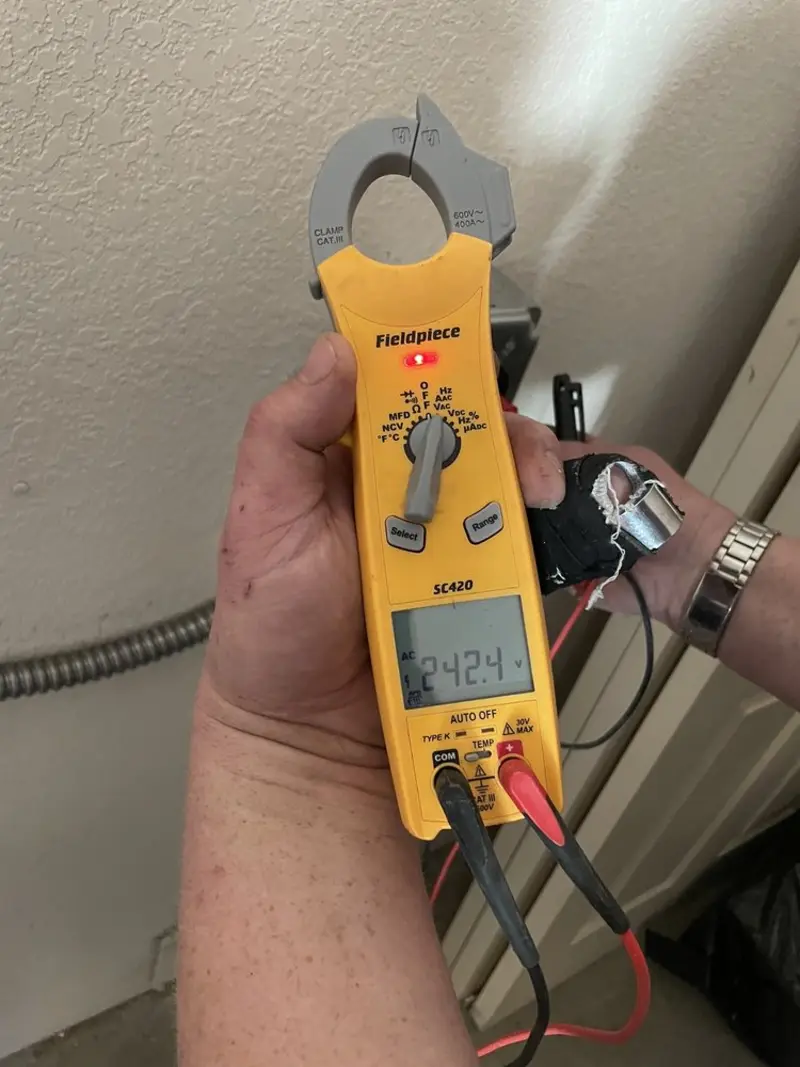 Voltage testing with clamp meter during Whole House Surge Protector in Ladonia